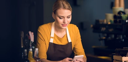 A waitress on her phone 