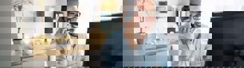 Image of an employee on a work call at home