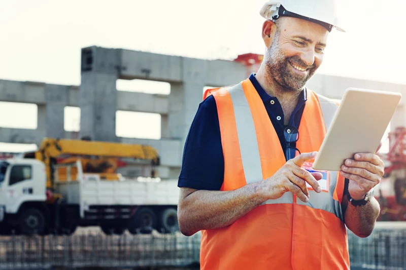 Construction worker using digital tablet