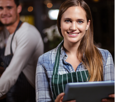 waitress holding an ipad in a hospitality setting