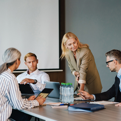 Work colleagues discussing work in a boardroom
