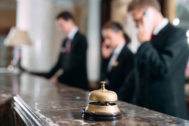old-fashioned bell on a hotel reception counter