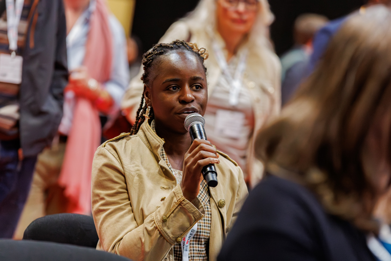 A GP speaking at the Responsible AI seminar during the Q+A segment.