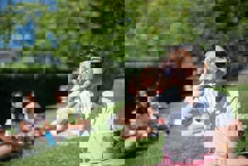 A child drinking water during the summer heat.