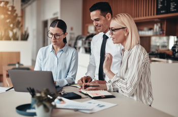 Business staff around a tablet