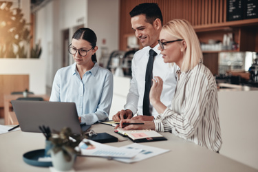 Business staff around a tablet