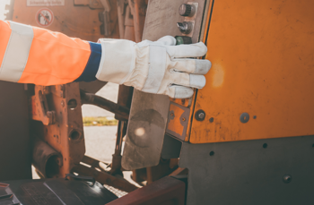Waste collector operating garbage truck