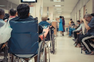 Image of busy hospital waiting room to reduce admissions