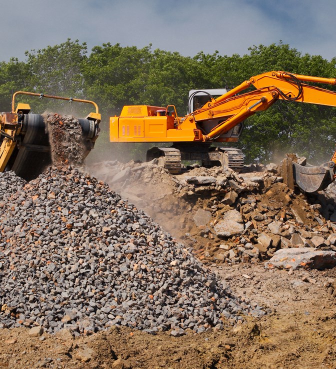 Heavy machinery and excavators with construction aggregate