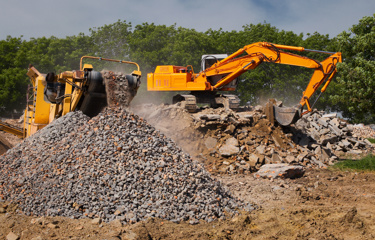 Heavy machinery and excavators with construction aggregate