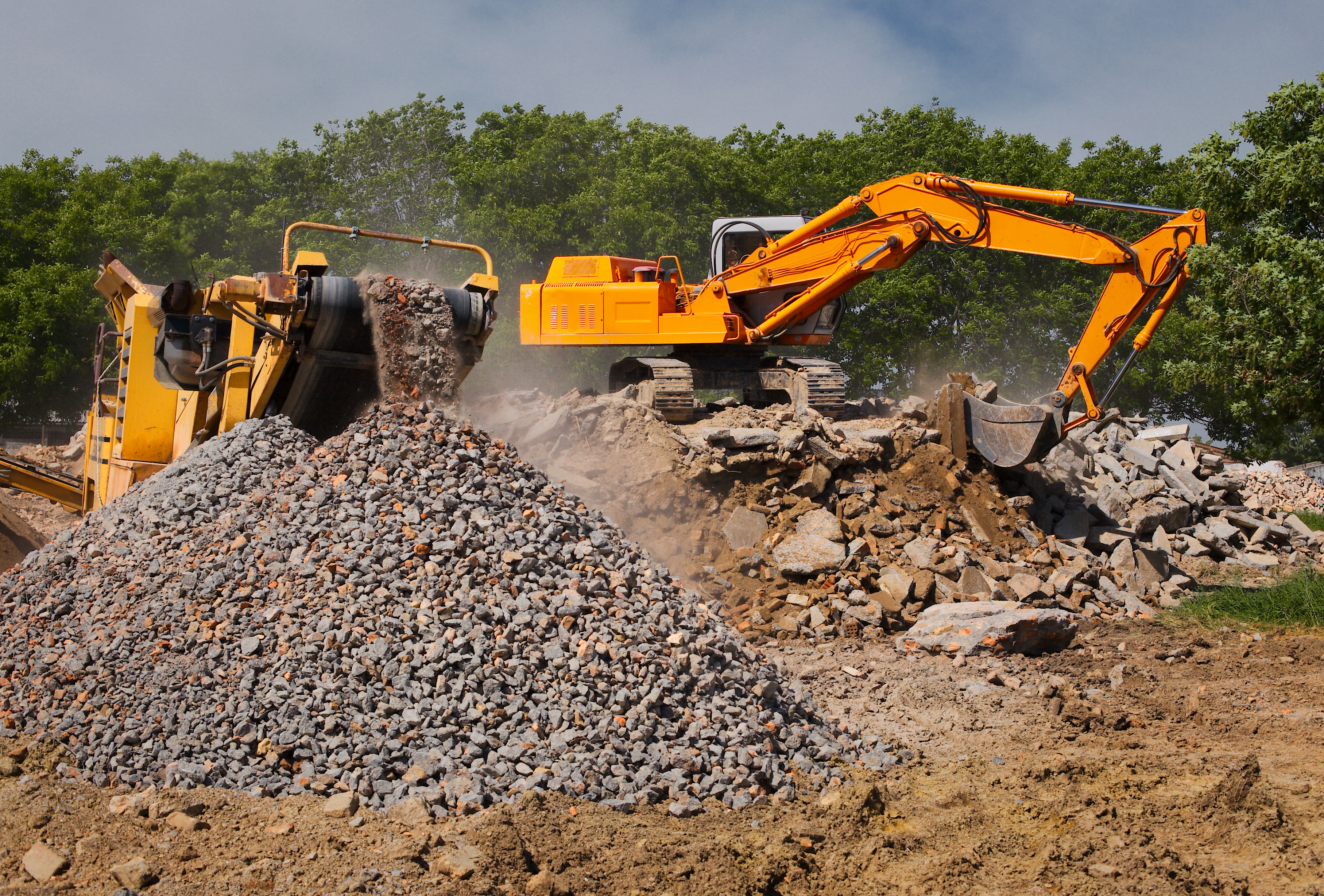 Heavy machinery and excavators with construction aggregate
