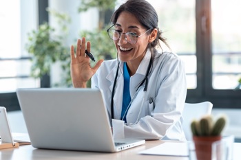 A GP using referral management software.