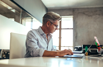 Paperless Law Firm - Man working on a laptop