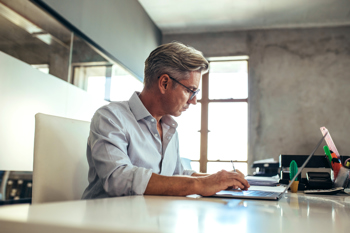 Paperless Law Firm - Man working on a laptop