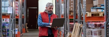 Distributor planning delivery on a laptop