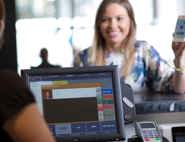 A woman paying at the counter