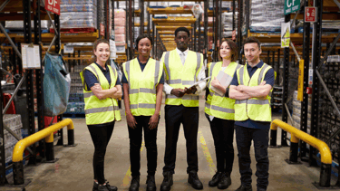 WMS team in the warehouse wearing safety vests