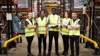 WMS team in the warehouse wearing safety vests
