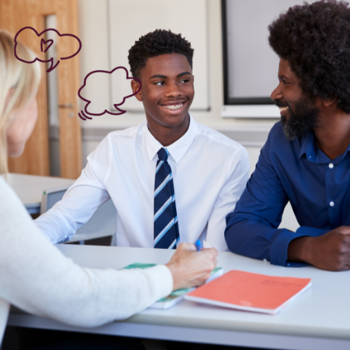 Teacher with parent and son sat across from each other at parents evening