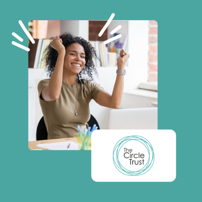 Woman in office at laptop cheering