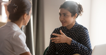 two young women having a conversation