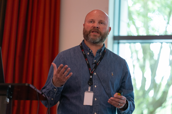 Miles Winterburn talking on stage at Access social care conference 2025