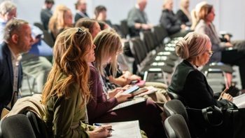 seated audience at digital health rewired 2025