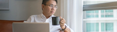 Image of man taking a coffee break in the office