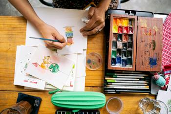 A young person in a local art group, orchestrated by social prescribing.