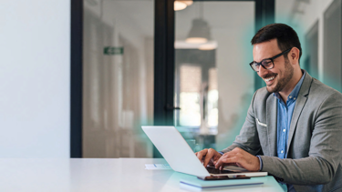 Man sitting on his laptop, glowing, AI Adoption Playbook