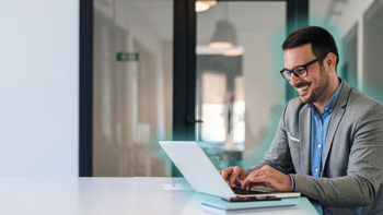 Man sitting on his laptop, glowing, AI Adoption Playbook