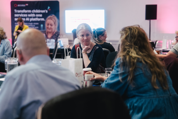 guests having discussion round a table at access group CYP conference 2026