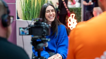 lady smiling while being interviewed at Rewired 2025