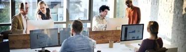 Image of typical day in the office with employees