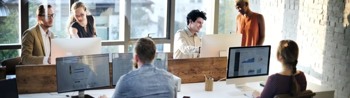 Image of typical day in the office with employees
