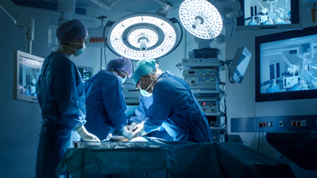 NHS surgeon working in an operating theatre.