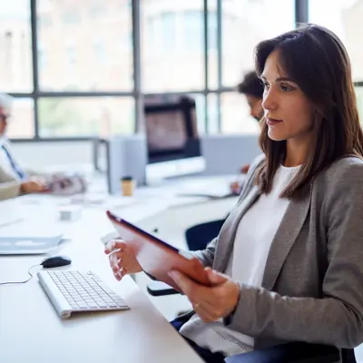 legal professional using a digital conveyancing and legal software platform at a modern office workstation