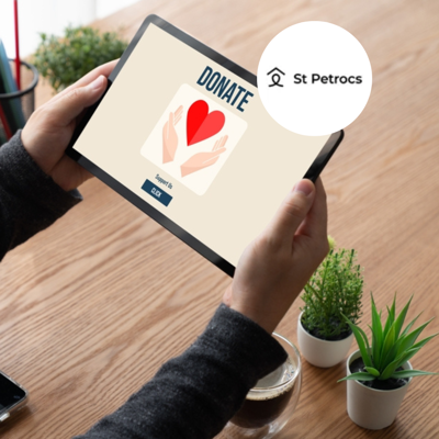 Person holding tablet which features a donation website