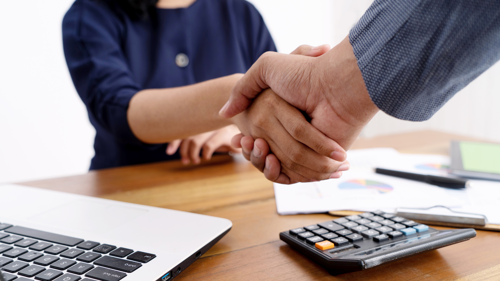 Men shaking hands together