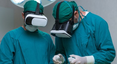 Two surgeons training using VR and AI technology.