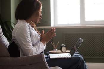 A mental health worker providing remote support.