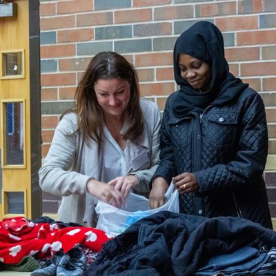 Two women packing a bag