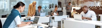 Image of small office with employees