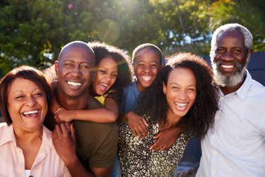 A black family smiling together