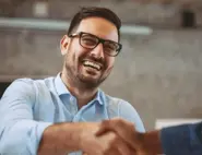 Professional person seated indoors during a customer testimonial