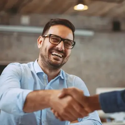 Professional person seated indoors during a customer testimonial